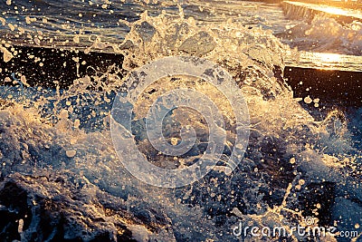 Bright sunlight passes through the splashes of sea waves. seascape Stock Photo
