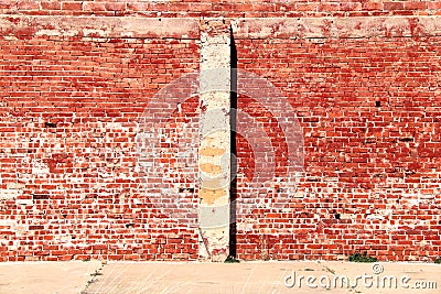 Bright sunlit vintage red brick building wall Stock Photo