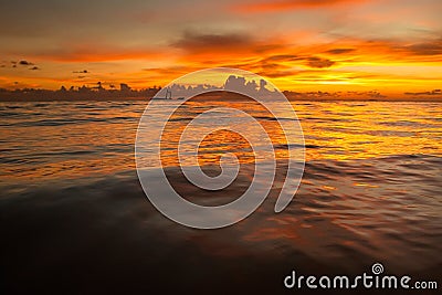 Bright sunrise in early morning with sand beach Stock Photo