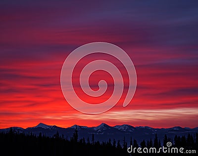 Bright Sunrise over Snow Covered Canadian Mountains Stock Photo