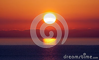 Bright sunset under the sea Stock Photo