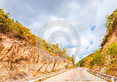 Bright sunshine day time Highway curve road overpass nature landscape background street tall lanterns trees bushes Stock Photo