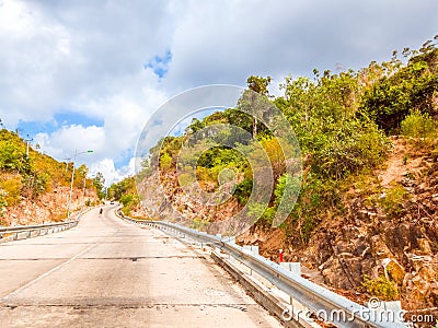 Bright sunshine day time Highway curve road overpass nature landscape background street tall lanterns trees bushes Stock Photo