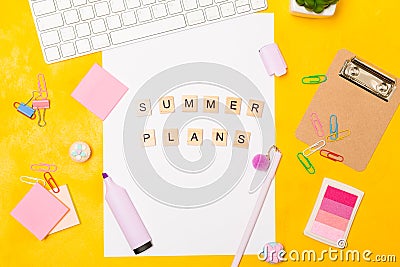 Bright vivid Flat lay workspace. Paper list with phrase summer plans and highlighter. Stationary and keyboard on yellow Stock Photo