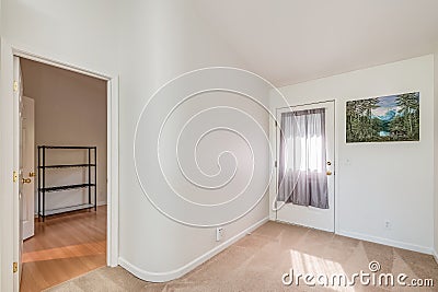 Bright white apartment entryway carpet and hard wood flooring real estate Editorial Stock Photo