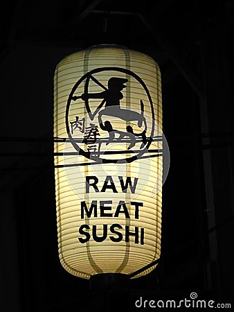 A bright white lantern outside the raw meat sushi restaurant Editorial Stock Photo