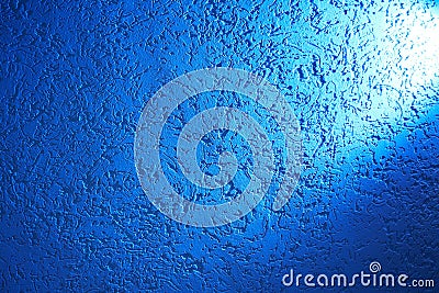 Bright white ray of light on a light blue structural background Stock Photo