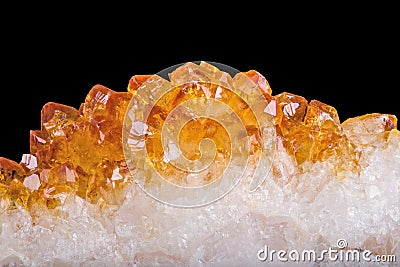 Bright yellow citrine crystals closeup on black Stock Photo