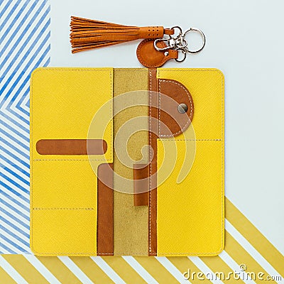 Bright yellow open travel wallet with branches for holding passport, money, boarding pass or id card. Stock Photo