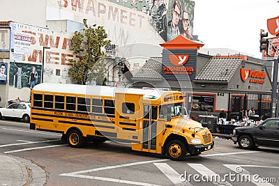 Bright yellow school bus on the road in Los Angeles Editorial Stock Photo