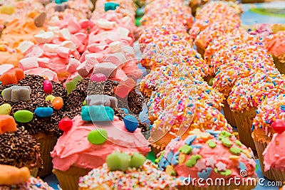Brightly colored cupcakes at a kids party Stock Photo