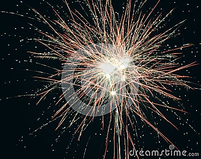 Brightly colorful explosive fireworks light up the night sky at New Year`s eve celebrations. Happy New Year 2017 and holidays Stock Photo