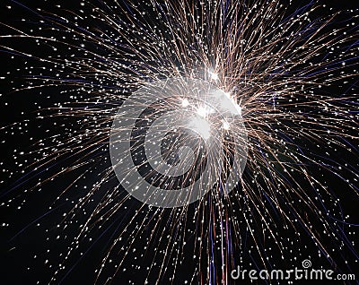 Brightly colorful explosive fireworks light up the night sky at New Year`s eve celebrations. Happy New Year 2017 and holidays Stock Photo