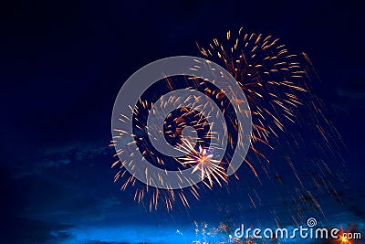Brightly colorful fireworks and salute of various colors in the night sky Stock Photo