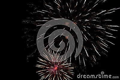 Brightly colorful fireworks and salute of various colors in the night sky background. selective focus Stock Photo