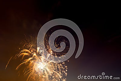 Brightly colorful fireworks of various colors in the night sky Stock Photo