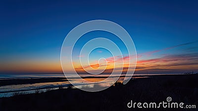 Brightly colorful sunrise on the sea coast. Early morning Stock Photo