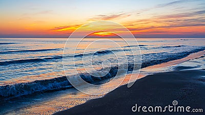 Brightly colorful sunrise on the sea coast scenery Stock Photo