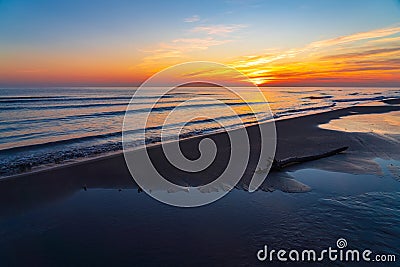 Brightly colorful sunrise on the sea coast. Nature wallpaper Stock Photo