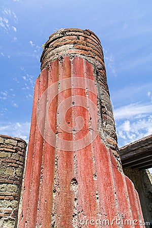 Brightly coloured classical column at Herculaneum, Italy Stock Photo