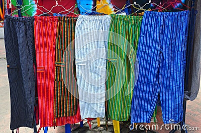 Brightly coloured handmade trousers Stock Photo