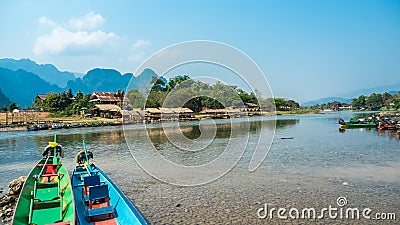 Colorful Pirogues on Nam Song River, Laos Stock Photo