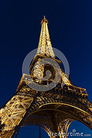 Brightly illuminated Eiffel Tower at night in late October Editorial Stock Photo