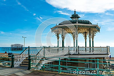 Brighton Pier Beach with Victorian bandstand octagonal pavilion Chinese and Indian style in the background Stock Photo