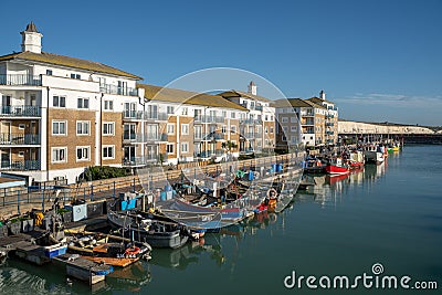 View of the Marina in Brighton Sussex on January 8, 2019, Four unidentified people Editorial Stock Photo