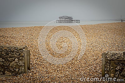 Brighton west pier and pebble overflow Stock Photo