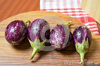 Brinjal, Eggplant, or Aubergine, on Wooden Background Stock Photo