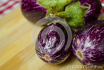 Brinjal, Eggplant, or Aubergine, on Wooden Background Stock Photo