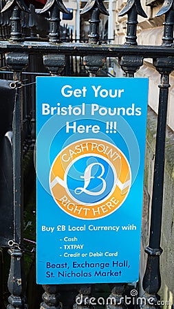 Bristol, UK - February 12 2020: Sign attached to railings advertising a cash point selling the local city currency Bristol Pounds Editorial Stock Photo