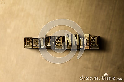 BRITANNICA - close-up of grungy vintage typeset word on metal backdrop Cartoon Illustration