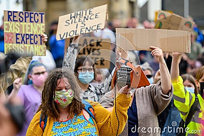 British BLM protesters wear PPE Face Masks and hold homemade signs at a Black Lives Matter protest in Richmond, North Yorkshire Editorial Stock Photo