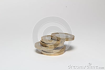 New one pound sterling coins isolated in white background, British currency monies Stock Photo