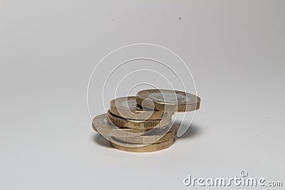 New one pound sterling coins isolated in white background, British currency monies Stock Photo