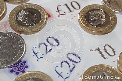 British currency notes and coins on white background Editorial Stock Photo