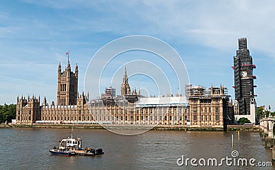 British Houses of Parliament and Big Ben clock tower covered by scaffolding for restoration, London, England Stock Photo