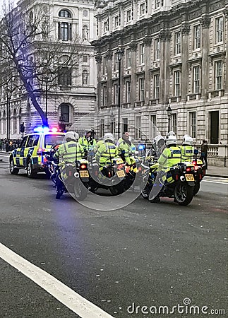 British Metropolitan Police Officer riding Motorbike on Syrian Protest/March Editorial Stock Photo