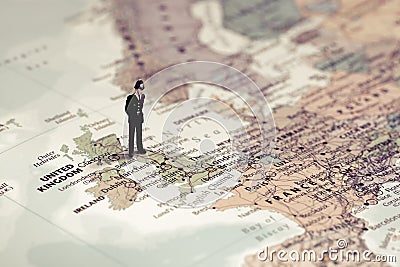 British police officer on top of UK map. Color tone tuned Stock Photo