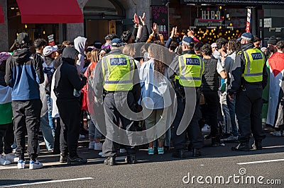 British police officers surround protesters at a Freedom for Palestine protest rally in London Editorial Stock Photo