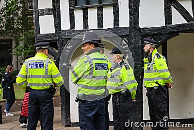 28 7 2022: British policeman briefing at Soho Square, London, preparing a major event, guarding the city Editorial Stock Photo