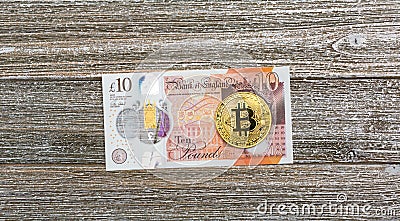 British Pound bills with Bitcoin Editorial Stock Photo