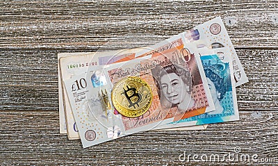 British Pound bills with Bitcoin Editorial Stock Photo