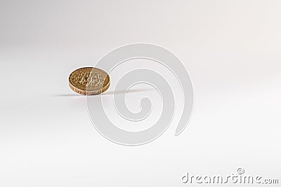 1 British pound coin falling on white background, isolated Stock Photo