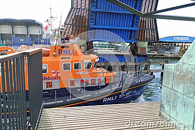 British lifeboat cruising under raised bridge Editorial Stock Photo