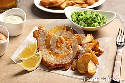 British traditional fish and potato chips on board Stock Photo