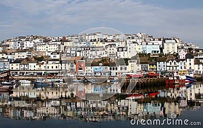 Brixham, South Devon, England: Harbour water reflections of colourful houses Stock Photo