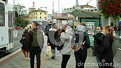 BRNO, CZECH REPUBLIC, JUNE 22, 2020: Coronavirus mask face tram streetcar stop crowd people women girls passengers they Editorial Stock Photo